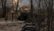 Ukrainian servicemen of the Skala regiment artillery unit fire an M109 howitzer toward Russian positions, in an undisclosed area, in the eastern Donetsk region, on April 23, 2025. (Photo by Roman Pilipey / AFP)