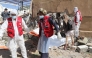 Yemeni rescuers transport the body of a victim from the rubble of a building hit in US strikes in the northern province of Saada on April 28, 2025. (Photo by AFP)