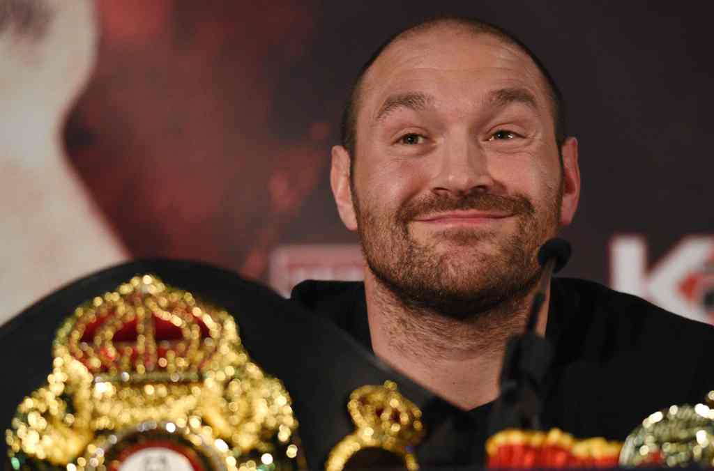 (FILES) This file photo taken on April 27, 2016 shows 
British heavyweight boxer Tyson Fury reacts during a press conference. / AFP / OLI SCARFF