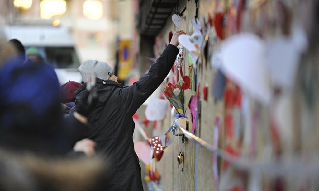 Well-wishers place flowers and cards outside a mosque after a fire in Eskilstuna, Sweden. Photograph: Pontus Stenberg/AP