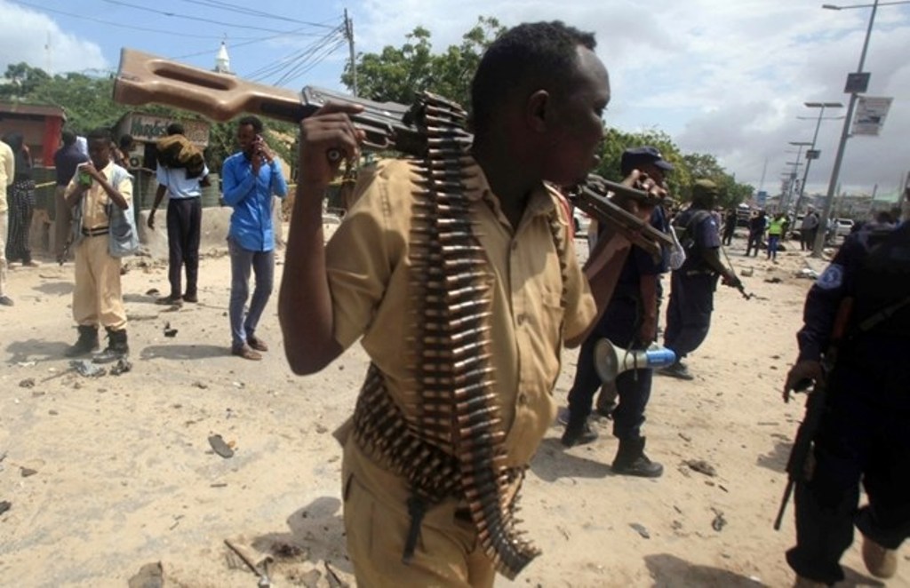 A Somali policeman walks at the scene of an explosion outside the headquarters of Somalia's Criminal Investigation Department (CID) in the capital Mogadishu, July 31, 2016. REUTERS/Ismail Taxta/File Photo.