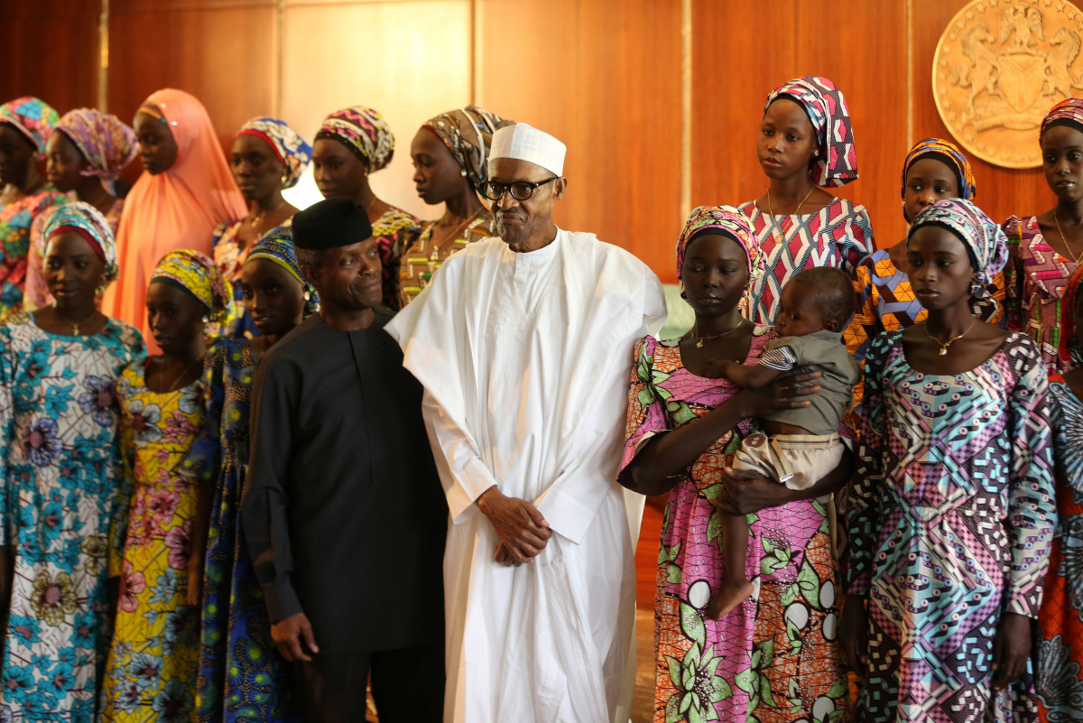 Some of the 21 Chibok schoolgirls released by Boko Haram pose during a group photograph with President Muhammadu Buhari and Vice President Yemi Osinbajo In Abuja, Nigeria October 19, 2016 REUTERS/Afolabi Sotunde