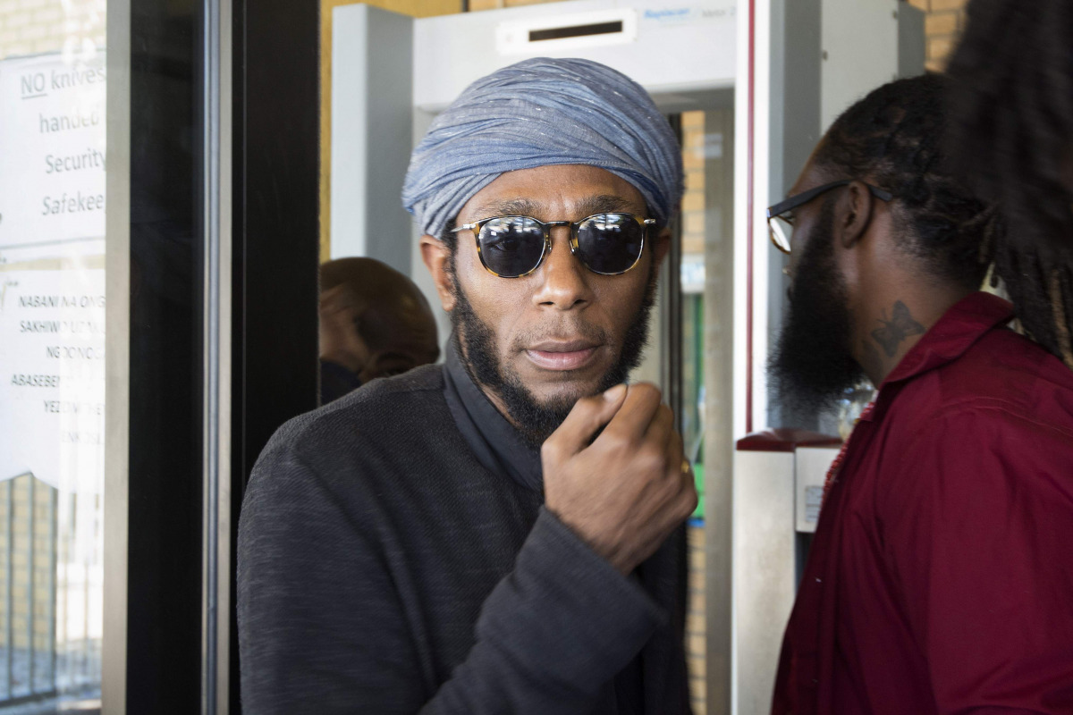 This file photo taken on March 8, 2016 shows Us hip hop artist and actor, Yasiin Bey, popularly known as Mos Def, walking out of the Bellville Magistrates Court, refusing to take off his turban as requested by security, before being due to appear for cont
