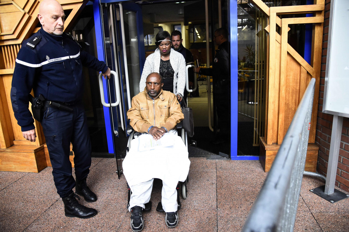 Former Rwandan army captain Pascal Simbikangwa leaving the courtroom during an adjournment of his appeal trial in Bobigny on October 25, 2016. A 