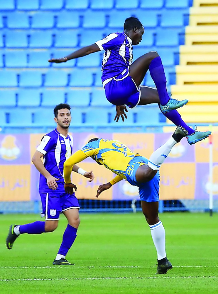 Action from the Qatar Stars League match between Al Gharafa and Muaither at Al Gharafa Stadium yesterday.