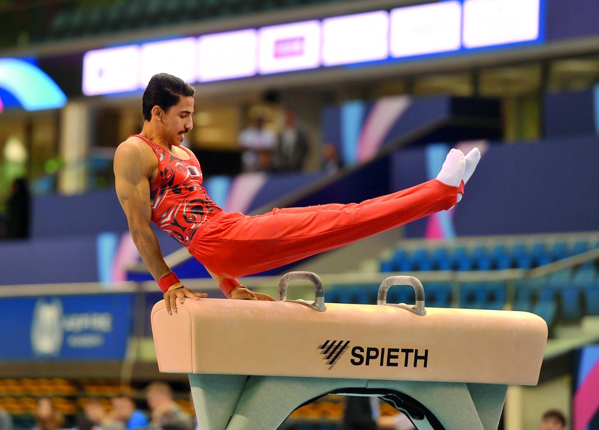 Qatari gymnast Ahmed Al Dayani in action during the men's Pommel Horse competition of the 10th Artistic Gymnastics World Cup at the Aspire Dome yesterday. Picture: Abdul Basit/The Peninsula