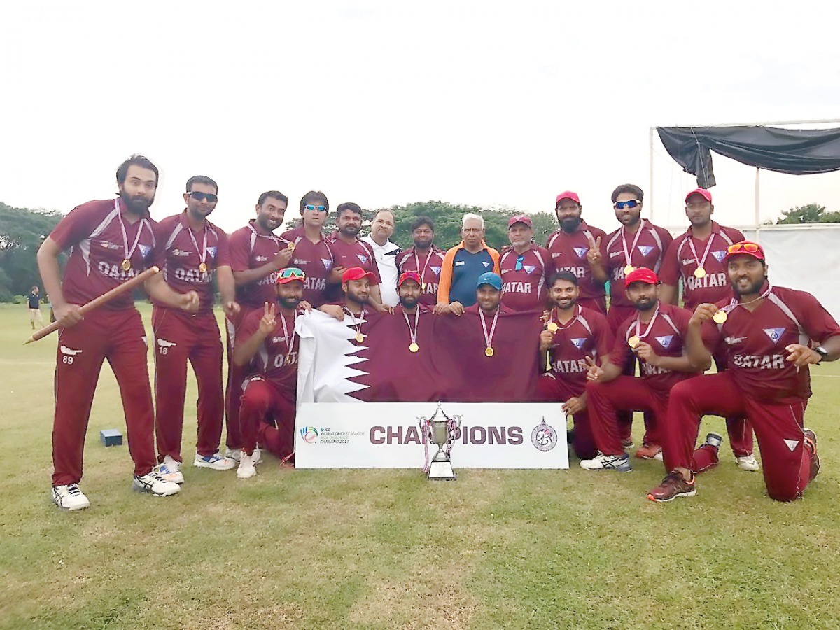 Qatar national cricket team players and officials pose for a photograph after winning the International Cricket Council’s (ICC) World Cricket League Asia Division 1 tournament in Chiang Mai, Thailand. The title-triumph - which came after Qatar beat Saudi 