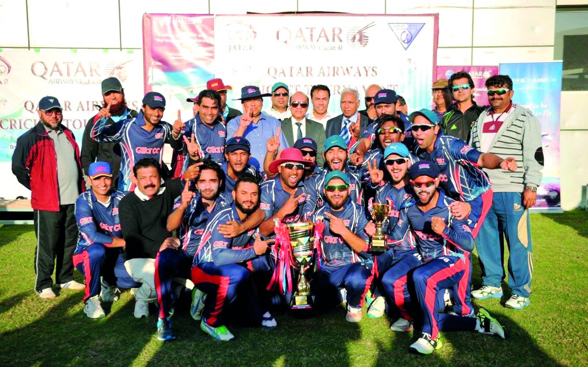 The victorious Galfar Al Misnad players and officials pose for a photograph after winning the Qatar Cricket Association 50 overs tournament.