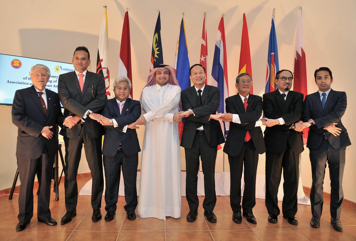 (Center) Haji Nordin Bin Haji Ahmad, Brunei Ambassador to Qatar and Vice Chairman of ACD, Ibrahim Fakhroo, Director of Protocol and Soonthorn Chaiyindeepum, Thailand's Ambassador to Qatar and Chairman of ACD with other officals during the Asean Flag Raisi