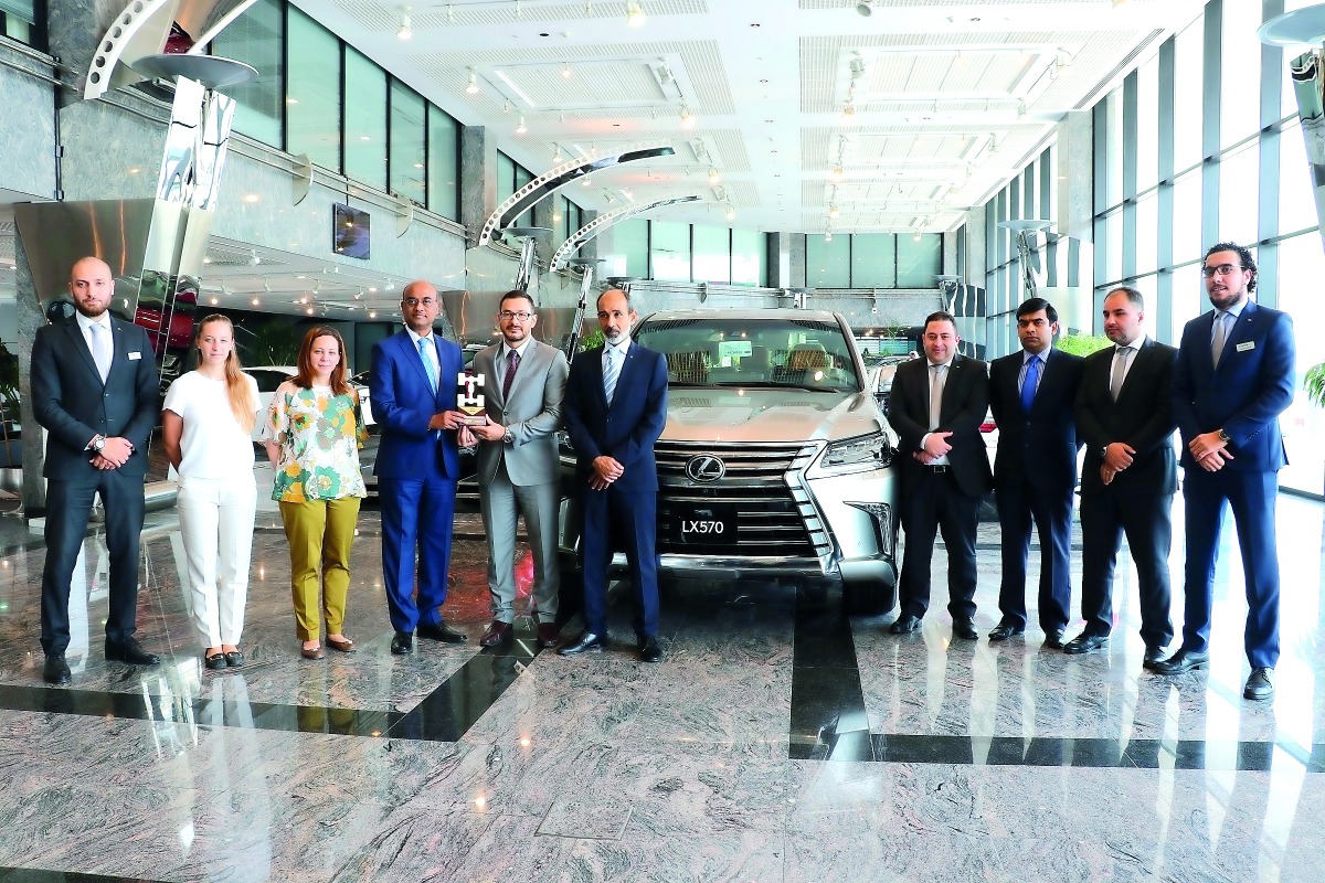 RK Murugan, AAB Acting CEO, receiving the award during an event in Lexus showroom.