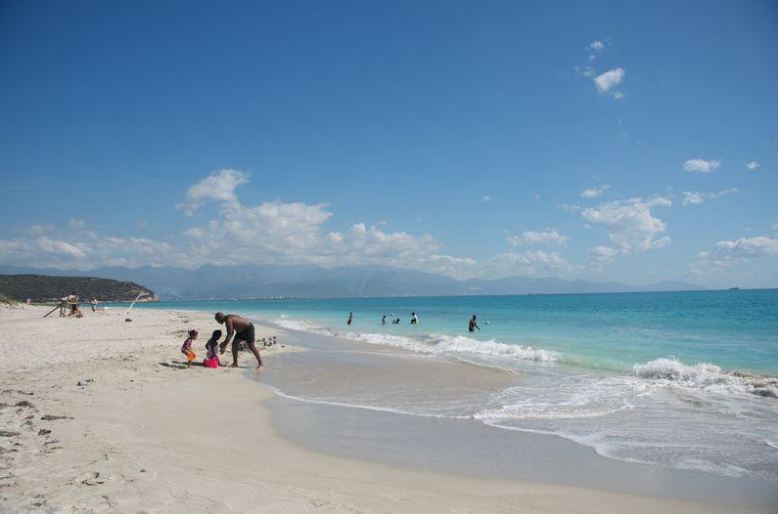 People relaxing at a Jamaican beach (Reuters)