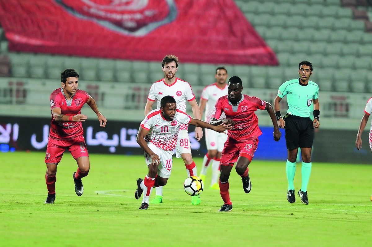 Al Duhail’s Moaaz Abdulla (second right) and Al Arabi’s Khalifa Ibrahim Al Khalfan (second left) vie for the ball possession during their QNB Stars League match played at Al Duhail Stadium, in this September 16, 2017 file photo. Al Duhail face Al Rayyan t