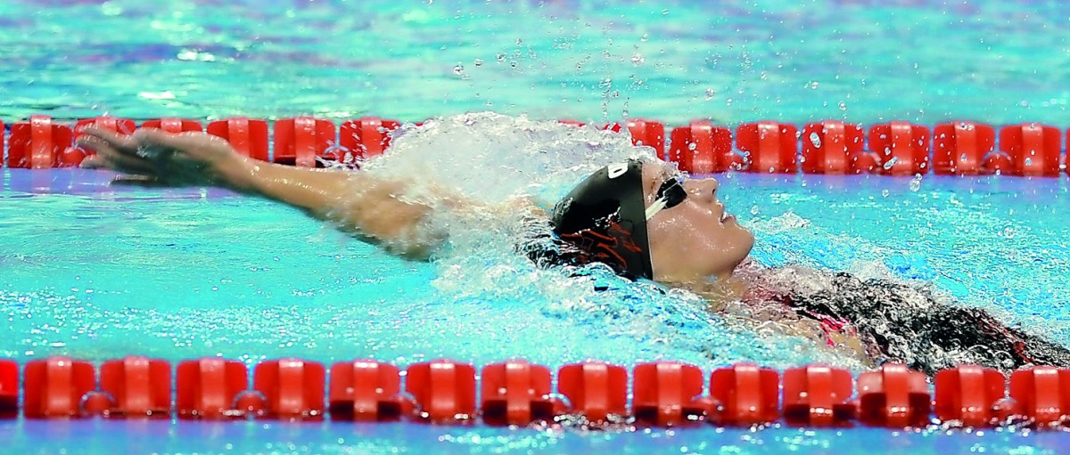 Hungarian star Katinka Hosszu on her way to win the gold medal in the Women’s 100m Individual Medley of the FINA airweave Swimming World Cup at the Hamad Aquatic Centre in Doha yesterday. Pictures: Salim Matramkot / The Peninsula