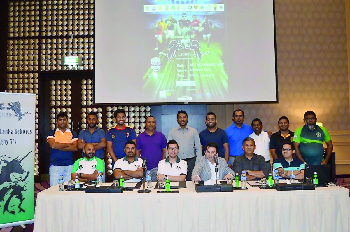 Tournament officials and team captains pose for a photograph during the draw ceremony.