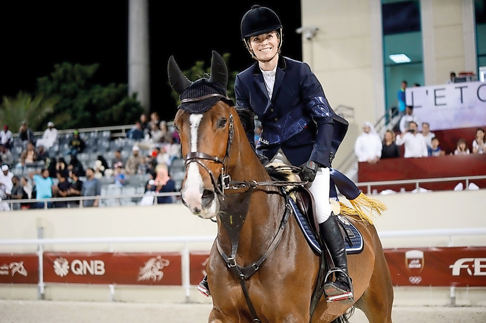 Australian rider Edwina Tops-Alexander celebrates after completing  flawless routine at the Qatar Equestrian Federation’s (QEF’s) Outdoor Arena yesterday.