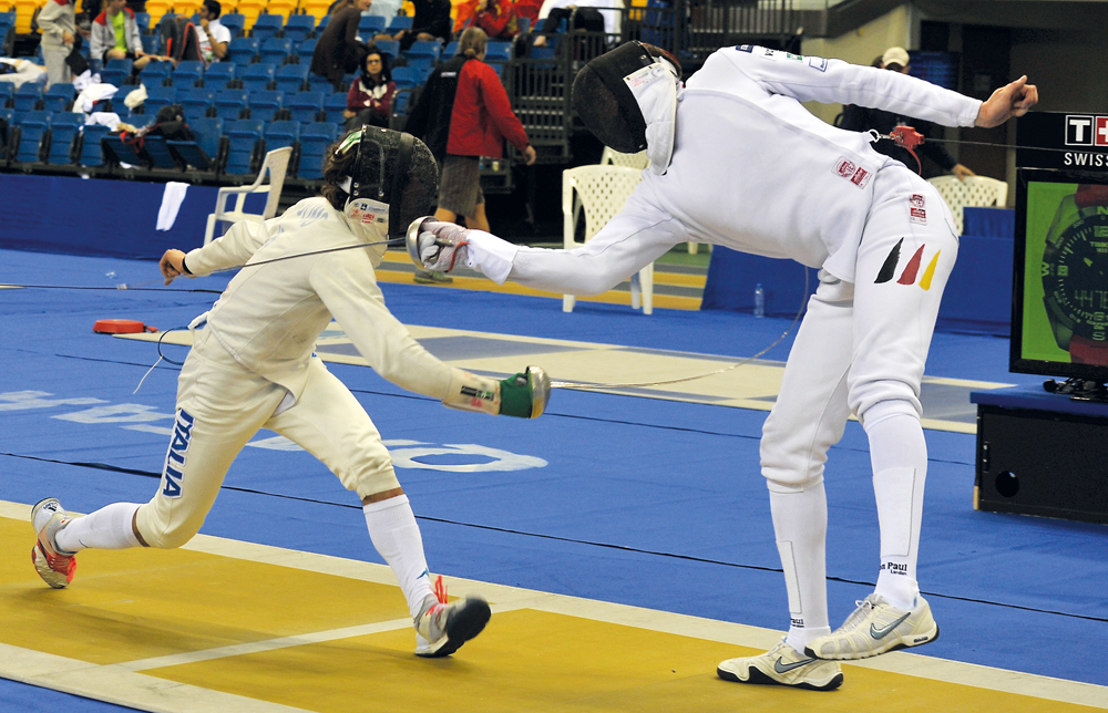 Action during the opening day of Qatar Fencing Grand Prix which got under way with the men’s preliminary rounds at Aspire Dome yesterday.
Picture: Kammutty VP / The Peninsula 
