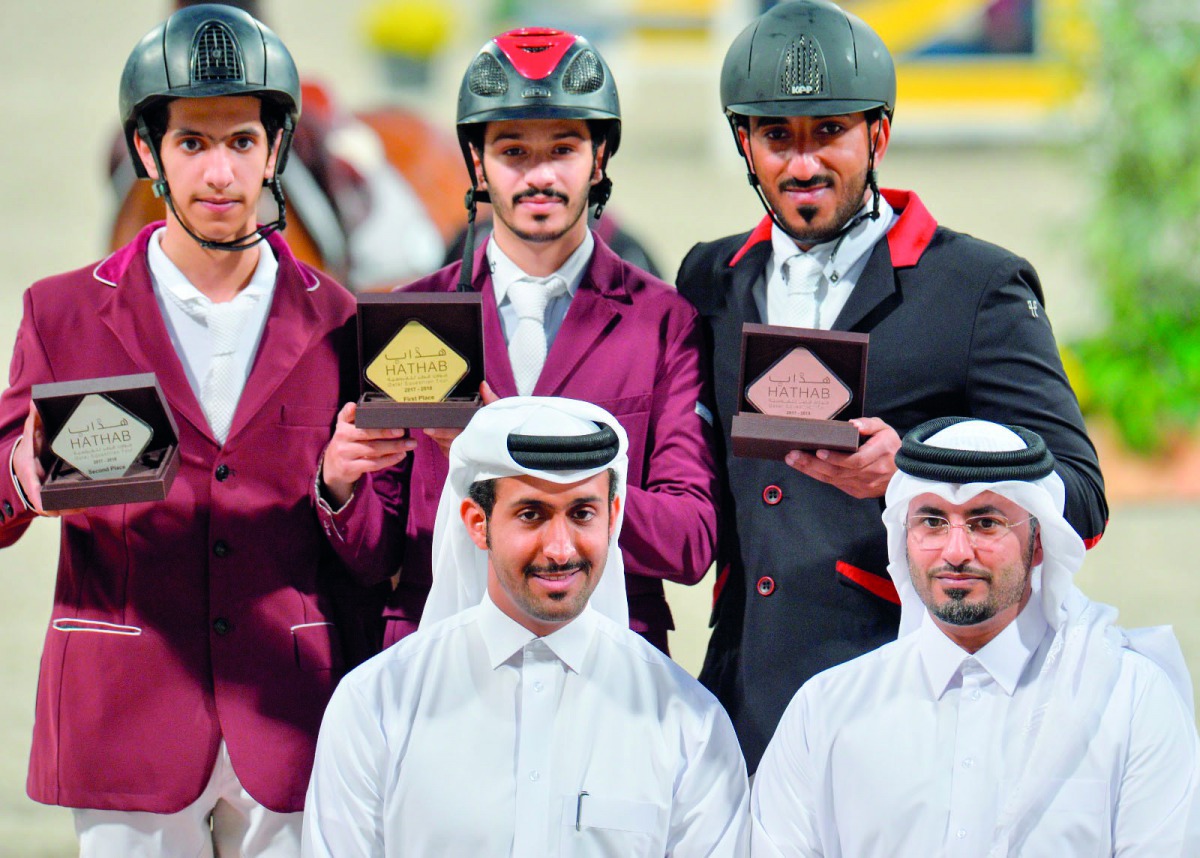 Podium winners of the Small Tour, Hamad Nasser Al Qadi, Mohammed Khalid Al Qashouti and Rashid Al Amri pose for a photograph with officials after the presentation ceremony, Hathab Equestrian Tour at the Qatar Equestrian Federation’s (QEF) indoor and outdo