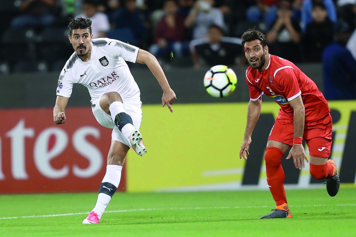 Al Sadd’s Baghdad Bounedjah shoots at the goal during the AFC Champions League match against Persepolis at the Jassim bin Hamad Stadium in Doha yesterday.