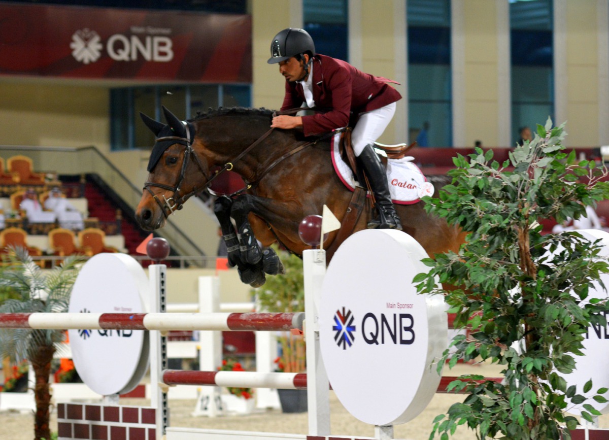 Qatari rider Awad Alqahtani guides Cassander Van Het Bremhof over an obstacle during the Big Tour of 2018 Emir’s Sword Festival yesterday.   