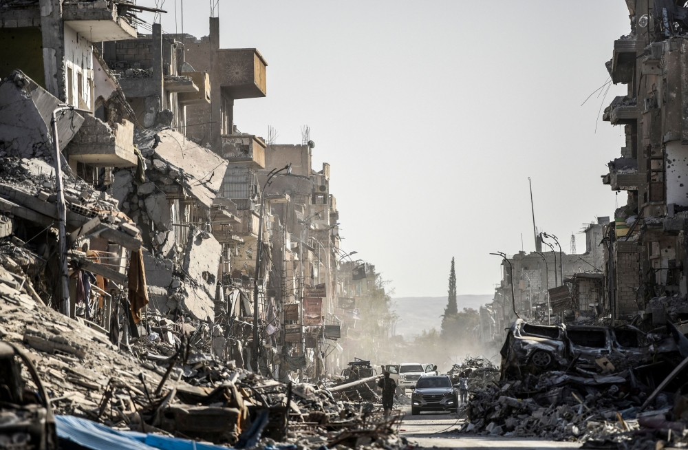 (FILES) This file photo taken on October 20, 2017 shows a general view of heavily damaged buildings in Raqa, after a Kurdish-led force expelled Islamic State (IS) group fighters from the northern Syrian city, formerly their 