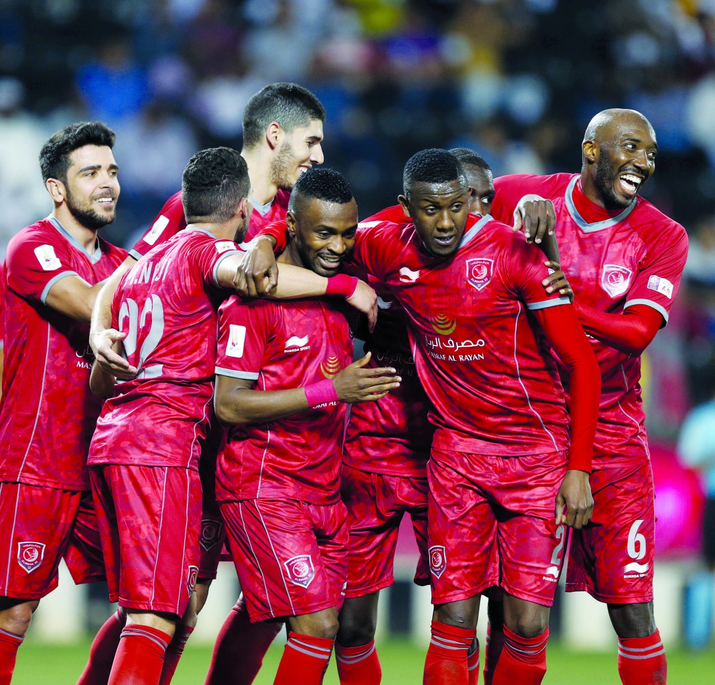 Al Duhail’s players celebrate after scoring during a QNB Stars league match in this file photo.