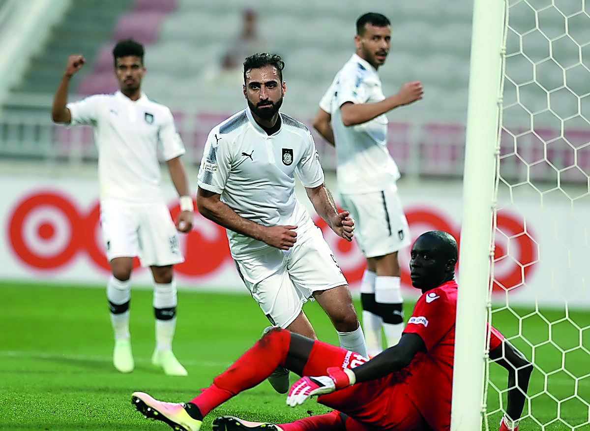 Al Sadd’s Ali Ferydoon scores their first goal against Al Khor during the first quarter-final of the Emir Cup at the Abdullah Bin Khalifa Stadium in Doha yesterday.