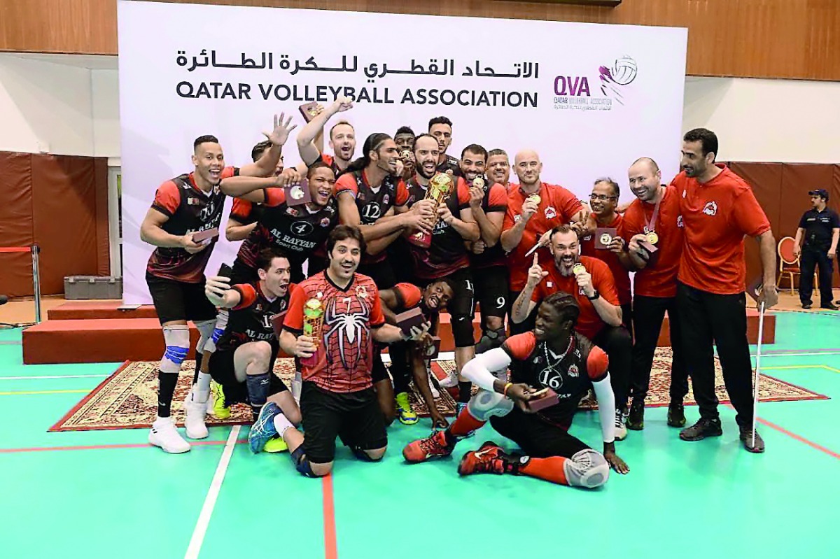 Al Rayyan’s players and officials celebrate with the Amir Cup trophy.  