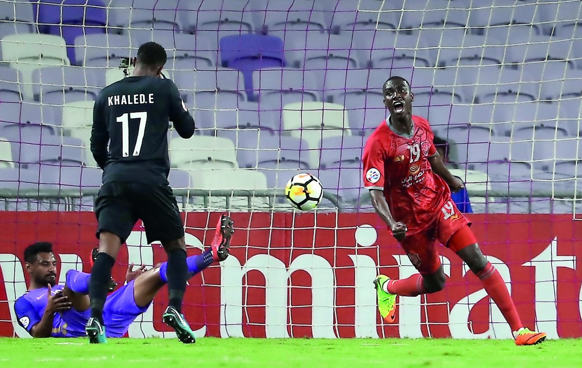 Al Duhail’s Almoez Ali celebrates after scoring a goal against Al Ain during the AFC Champions League Round of 16 first leg match at the Hazza Bin Zayed Stadium, on February 20, 2018. 
