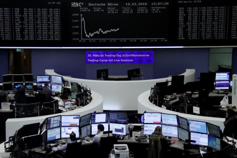 FILE PHOTO: The German share price index, DAX board, is seen at the stock exchange in Frankfurt, Germany, March 19, 2018. REUTERS/Staff/Remote
