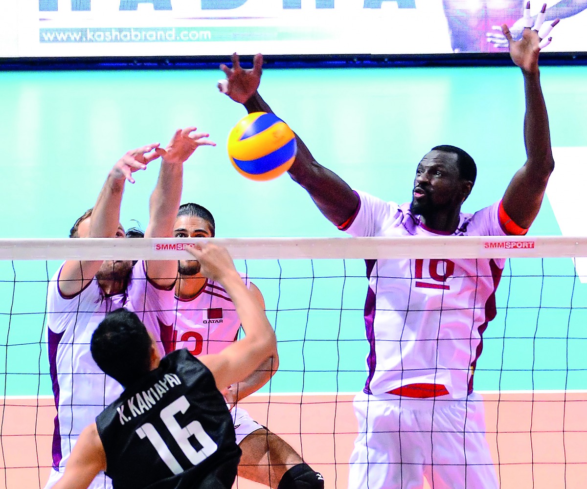 Qatari players blocking a dash hit by a Thai player during their AVC Cup Pool C match played at the University of Taipei (Tianmu) Gymnasium in Taipei, Chinese Taipei yesterday.  