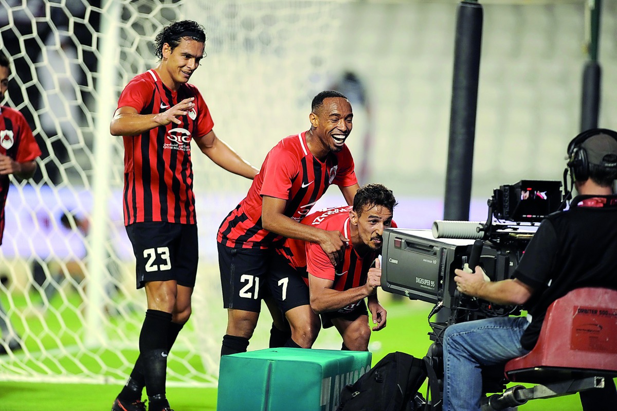 Al Rayyan players celebrate after scoring during the Sheikh Jassim Cup at the Khalifa International Stadium in Doha in this August 1 file photo.