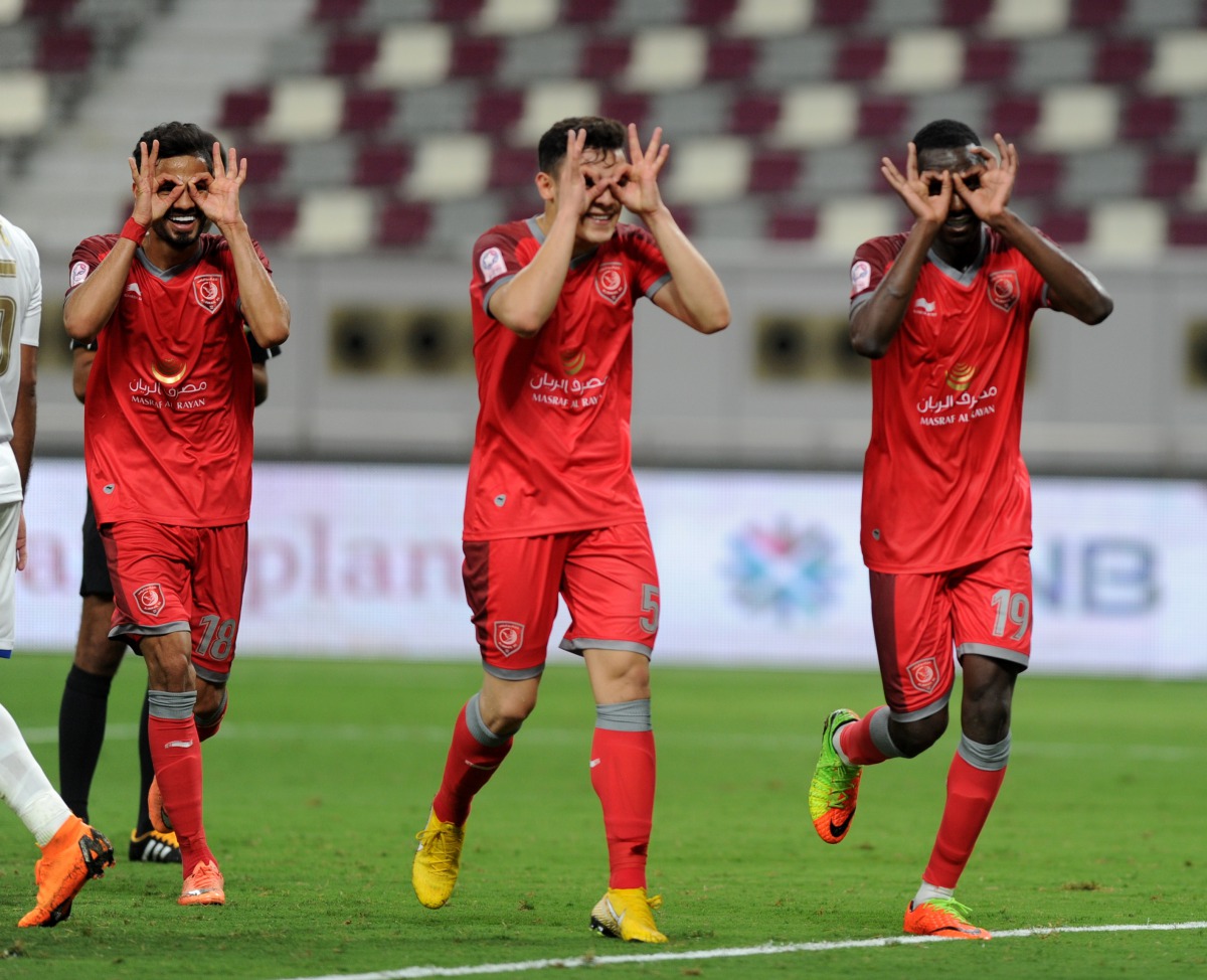 From left: Sultan Al Brake Bassam, Hisham Al Rawi,  Al Duhail’s Almoez Ali celebrate after the latter scored a goal against Al Khor during their QNB Stars League (QSL)match played at the Khalifa International Stadium yesterday.  Pictures by: Abdul Basit /