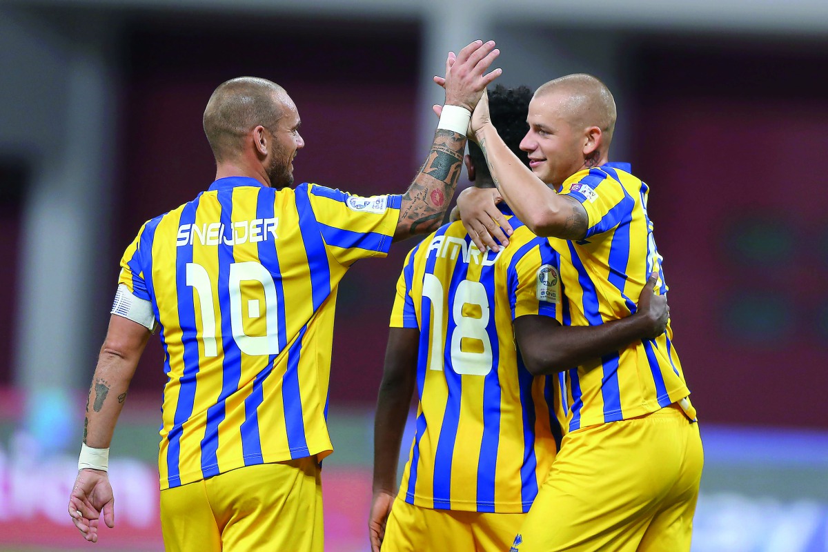 FROM LEFT: Al Gharafa’s Wesley Sneijder, Amro Abdullfattah Siraj and Vladimir Weiss celebrate a goal during their 4-0 win over Al Ahli in the QNB Stars League on Friday.