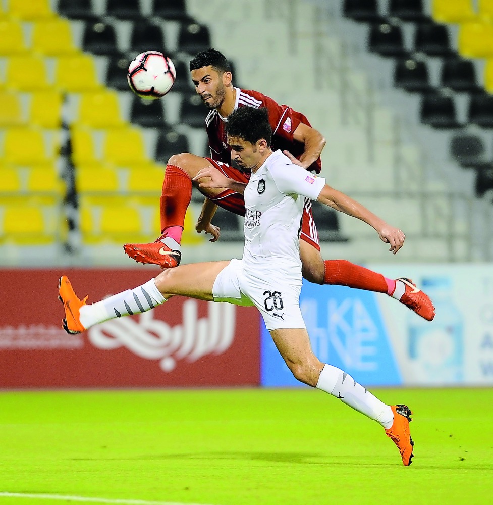 Al Sadd’s Aladeen Suleiman Younes (foreground) vies for the ball possession with an Al Shahania player during their QSL Cup Group match played at the Suhaim bin Hamad Stadium. Pictures: Anvar Sadath  