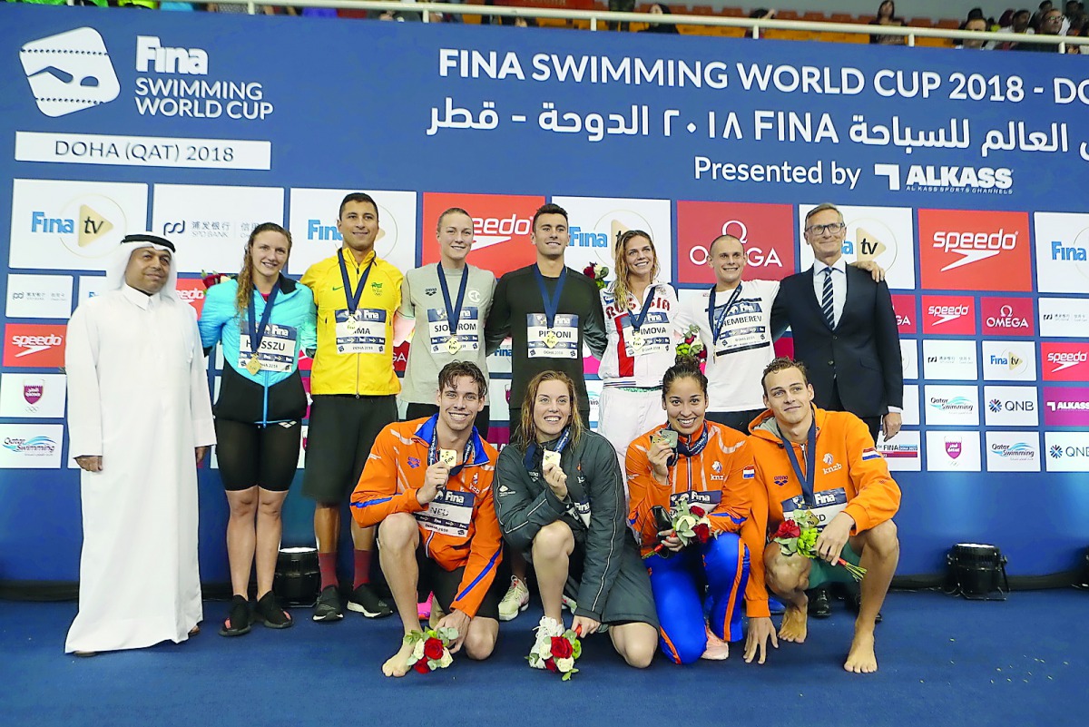 STANDING FROM LEFT: Winners on the second day of FINA Swimming World Cup 2018 - Doha edition, Hungarian speedster Katinka Hosszu, Brazil’s Felipe Lima, Sweden’s Sarah Sjostrom, USA’s Blake Pieroni, Russia’s Yuliya Efimova, Azerbaijan’s Maksym Shemberev an