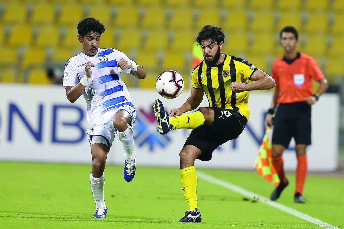 Qatar SC’s Rami Fayez Shamalah (right) controls the ball during the QSL match against Al Khor at Suhaim bin Hamad Stadium, yesterday. The match ended in a goalless draw.   