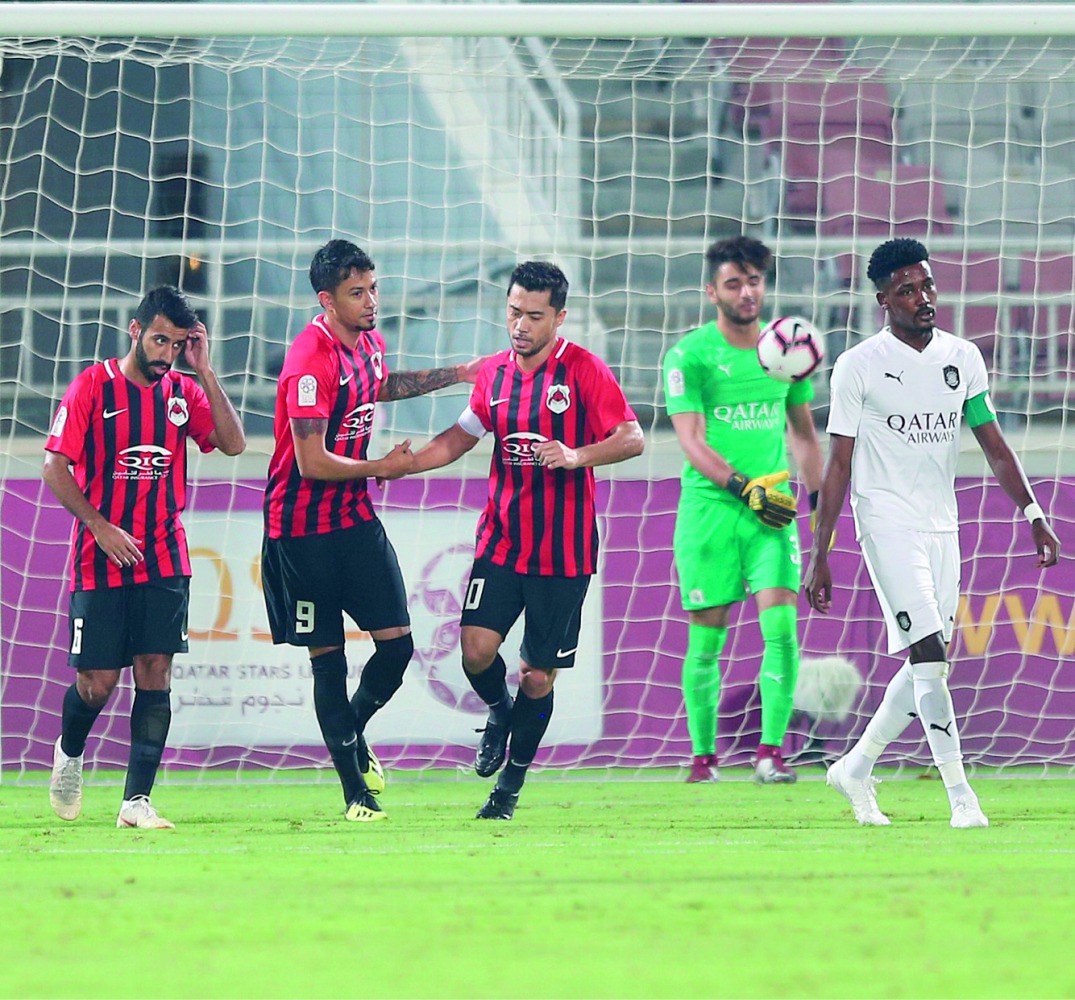 Al Rayyan captain Rodrigo Tabata (centre) shakes hands with Lucca Borges as they celebrate a goal against Al Sadd during their QSL Cup match yesterday. 