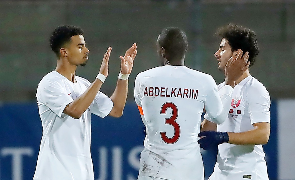 Qatar’s Akram Afif (left) celebrates with team-mates after scoring a goal against Switzerland during their international friendly in Lugano, Switzerland on Wednesday. 