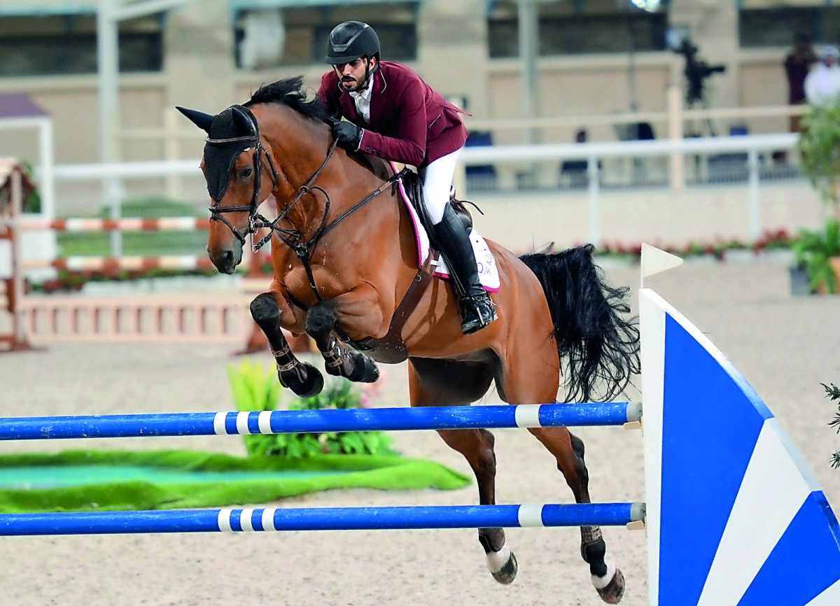 Mubarak Yousef Al Rumaihi  guided Bolandro over an obstacle during the feature event on the opening day of the QNB Qatar International Show Jumping Championship at the Qatar Equestrian Federation’s (QEF) Outdoor Arena yesterday.