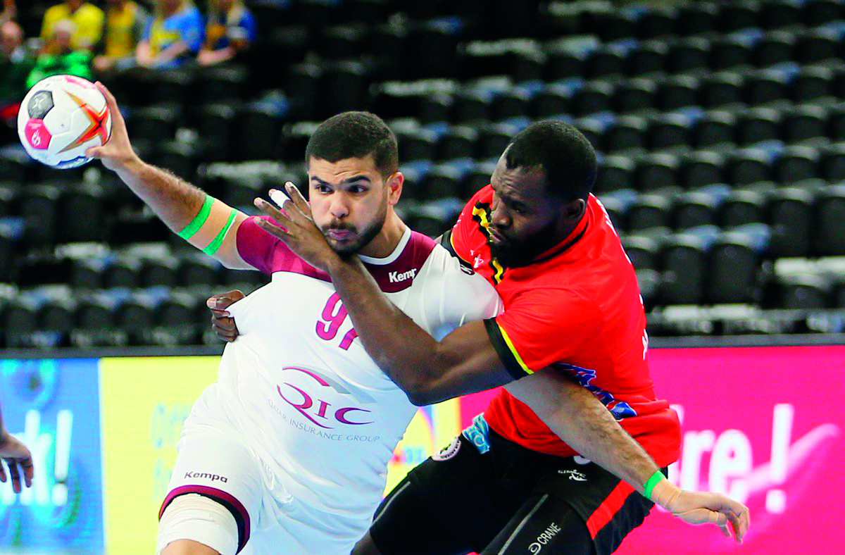 Qatar's Moustafa Heiba (left) in action during yesterday's match. 