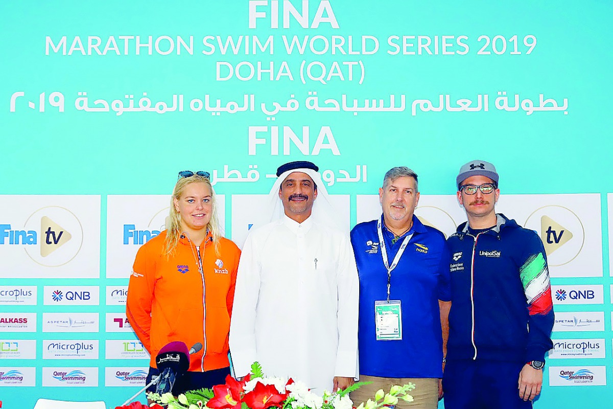 From left:  Dutch swimmer Sharon Van Rouwendaal, QSA President Khaleel Al Jabir, FINA Technical Delegate John West and Italian star Simone Ruffini pose for a group picture after press conference, yesterday.   