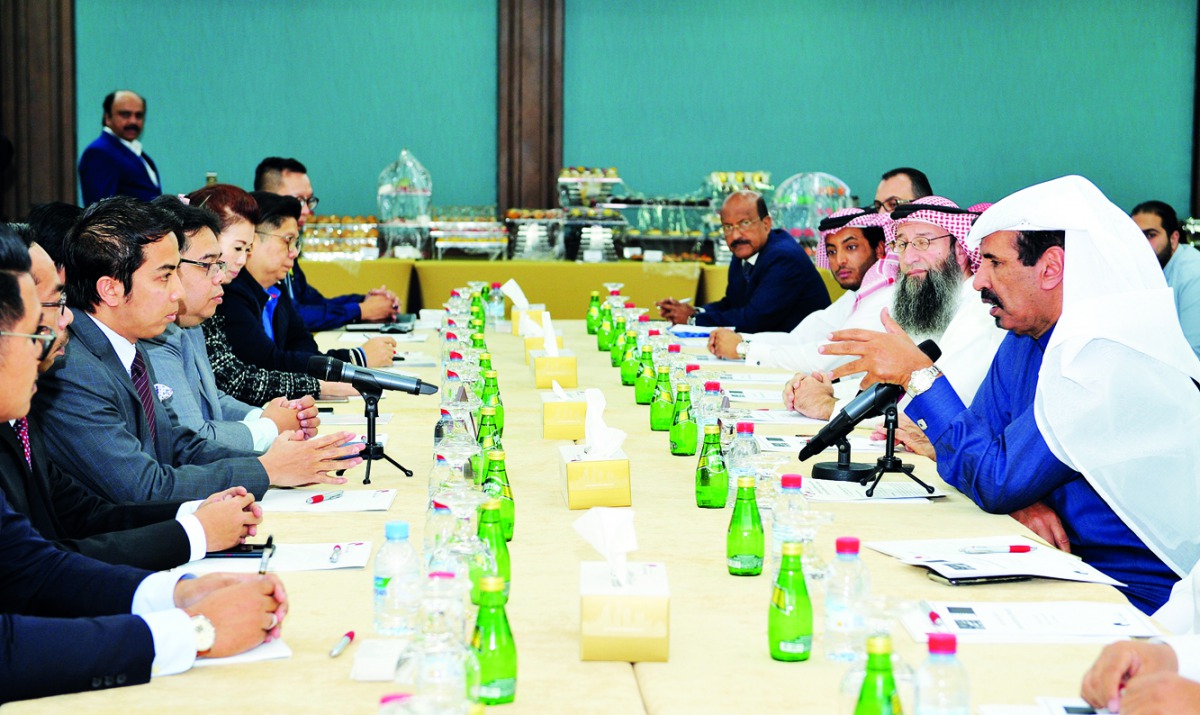 Mohammed bin Ahmed bin Towar Al Kuwari, First Vice-Chairman of Qatar Chamber; and Mohd Shahir Sabaruddin, Deputy Head of Mission, Embassy of Malaysia; with other officials from the Qatar Chamber and the visiting Malaysian Business Delegation, at a meeting