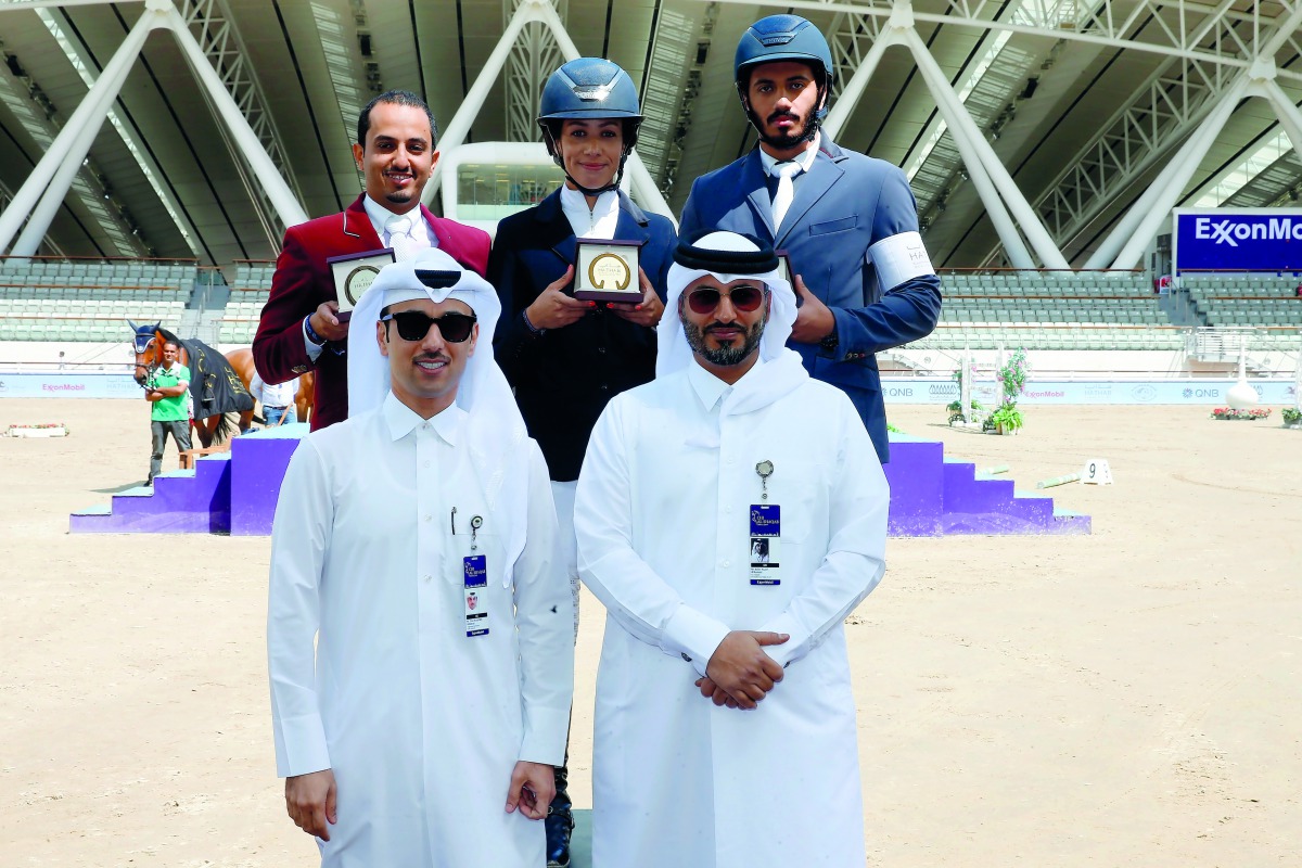 Commercial Manager of Al Shaqab, Omar Al Mannai (left) and Hathab Series Tournament Director, Ali Al Rumaihi pose for a photograph with the podium winners of the Big Tour competition of Round 9 of the Hathab Series, Faleh Suwead Al Ajami, Cyrine Cherif an