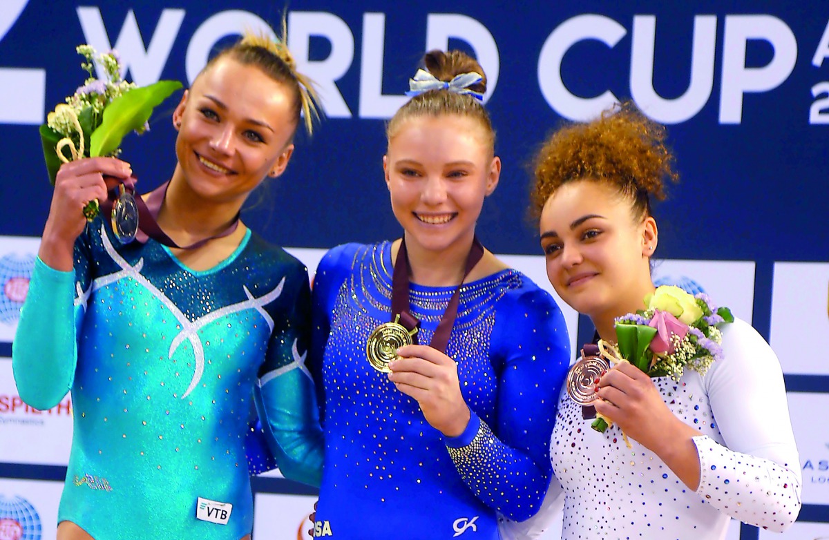 Gold medallist Jade Carey (centre) poses along with silver medallist Maria Paseka (left) and bronze medallist Coline Devillard after the medals ceremony for women’s vault event, yesterday. 
