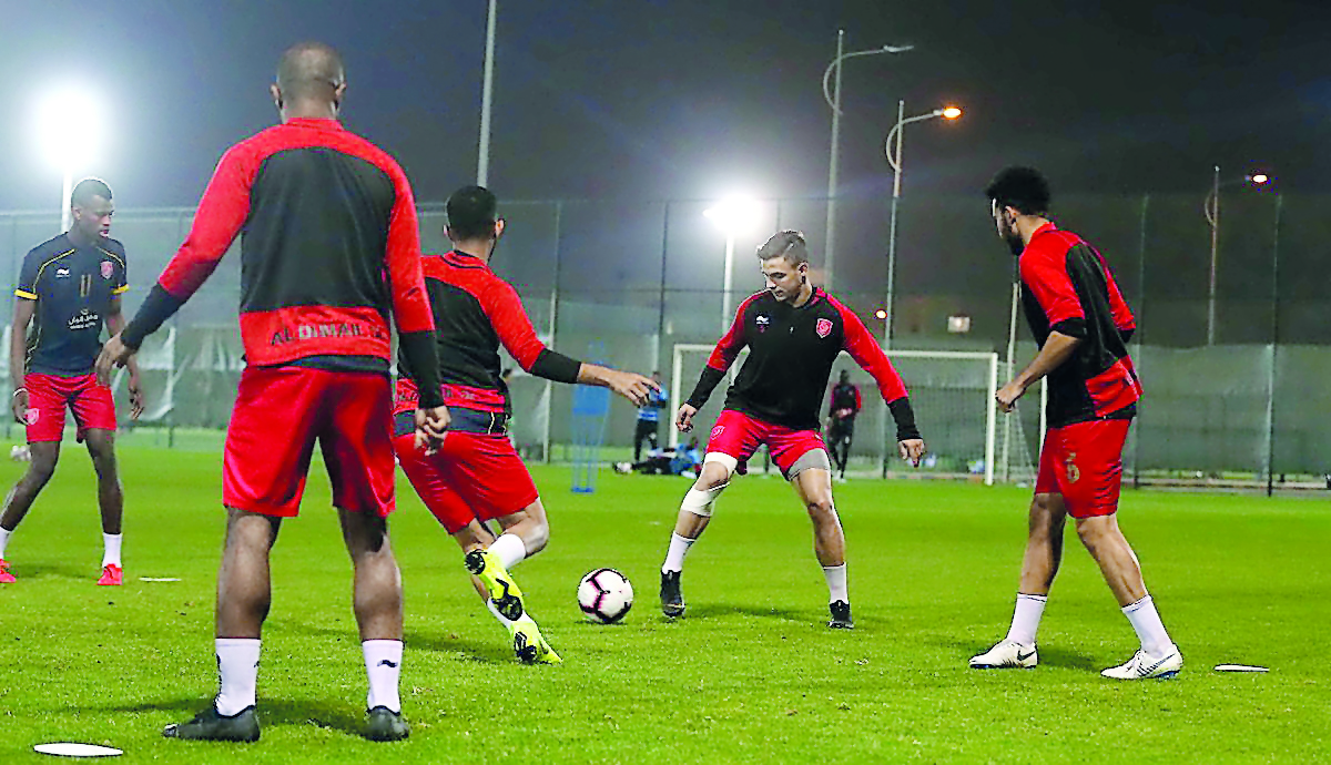 Al Duhail’s Bassam Al Rawi (centre) trains with his team-mates ahead of the QNB Stars League Round 20 match against Al Sadd, which will be played on Saturday.  