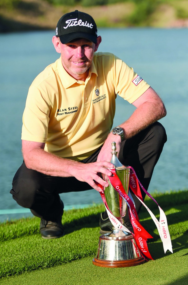 Stephen Gallacher of Scotland holds his trophy after winning the men's Hero Indian Open golf tournament in Gurgaon on the outskirts of New Delhi on March 31, 2019. AFP / Money Sharma
