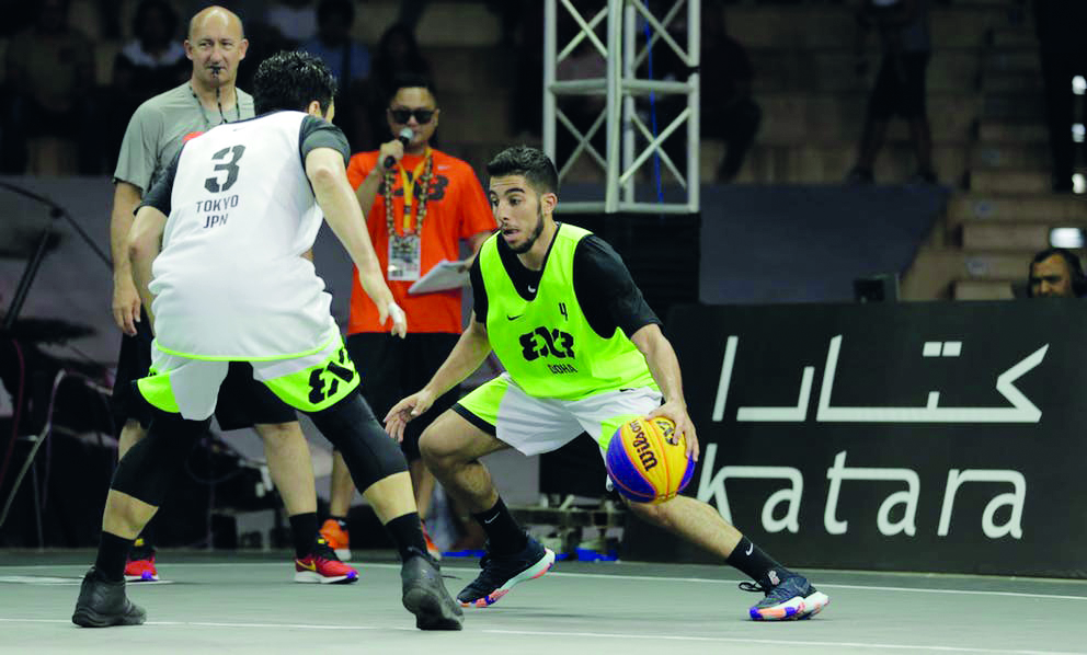 Doha’s Moustafa Essam Fouda (right) dribbles during the Pool B game against Tokyo, on the opening day of the FIBA 3x3 World Tour – Doha 2019 at Katara Amphitheatre, yesterday.