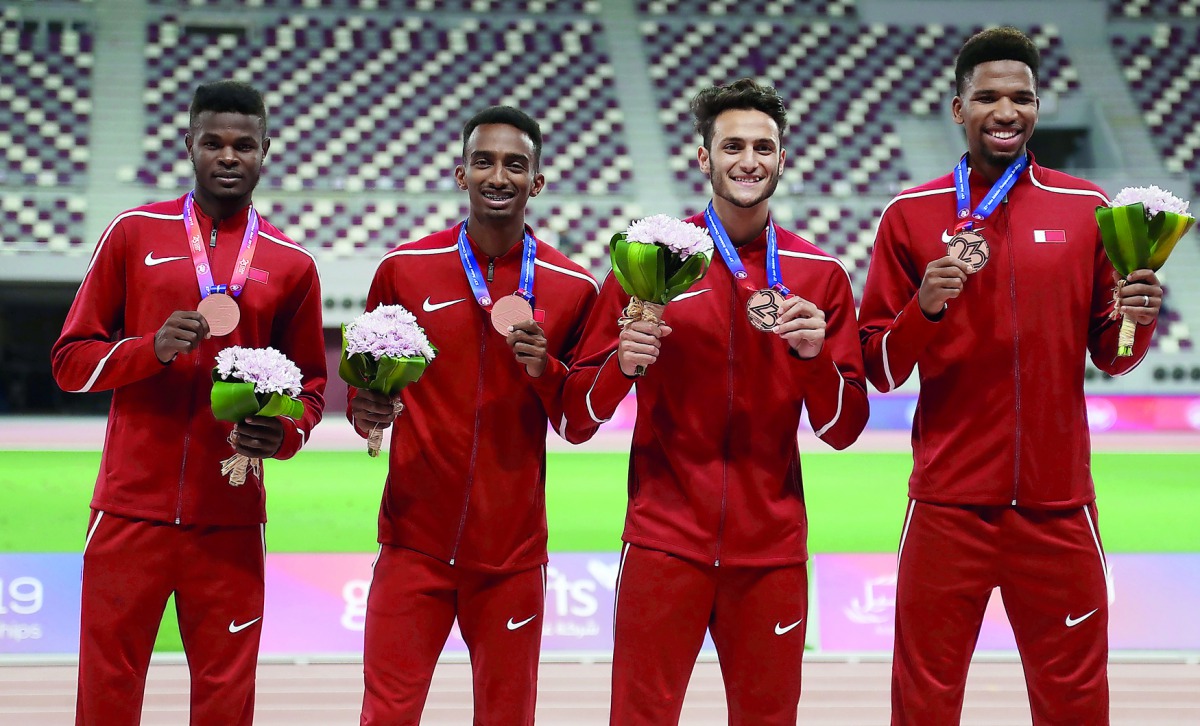 Qatar’s Men’s 4x400m Relay team consisting of Osman Ashraf, Abdalla Abubaker, Bassem Hemeida and Abderrahman Samba, celebrate on the podium with their bronze medals during the Asian Athletics Championships at the Khalifa International Stadium, yesterday. 