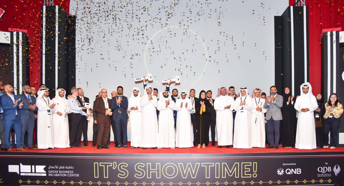 Qatar Business Incubation Center officials with winners of the 12th wave of QBIC LeanStartup Program celebrating at the Sheraton Doha Hotel, yesterday.