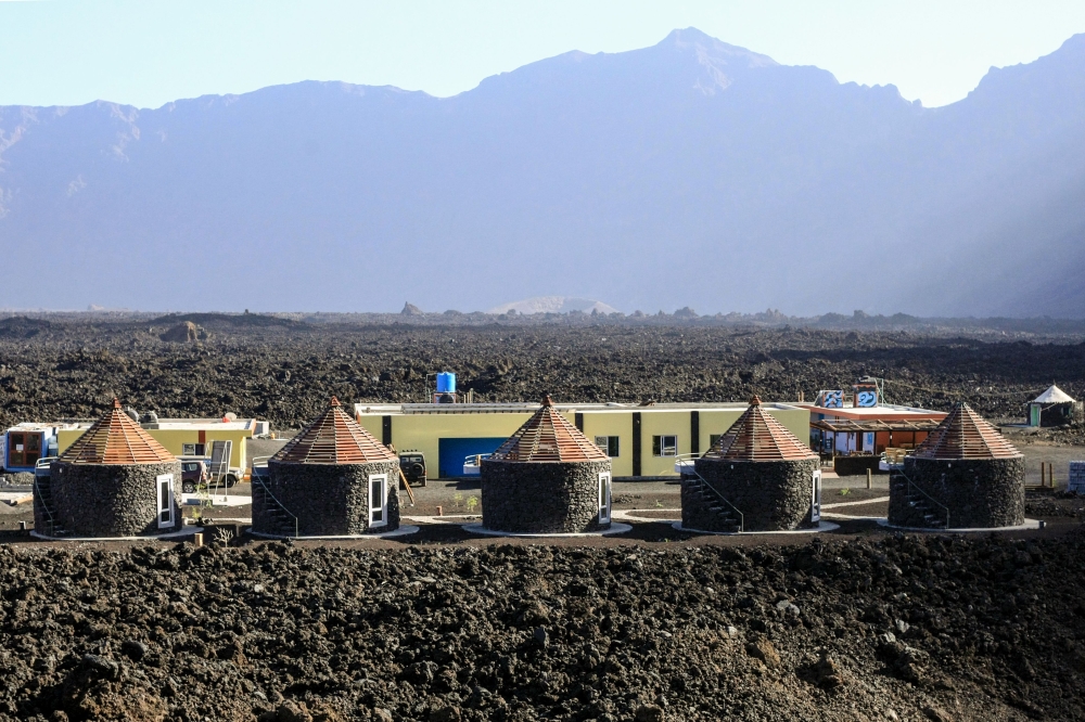 This picture taken on March 30, 2019 shows the newly built Marisa's hotel, made with cement and lava on the roof of the owner's former house, in the village of Portelo in Cape Verde's Cha das Caldeiras valley. AFP / Anne-Sophie Faivre Le Cadre 